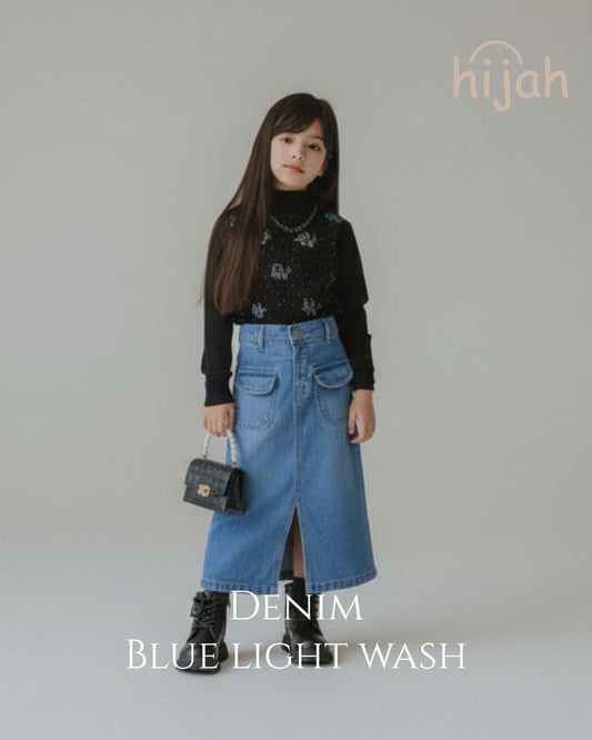 Child wearing Hijah Denim Blue Light Wash skirt with patterned black turtleneck and handbag